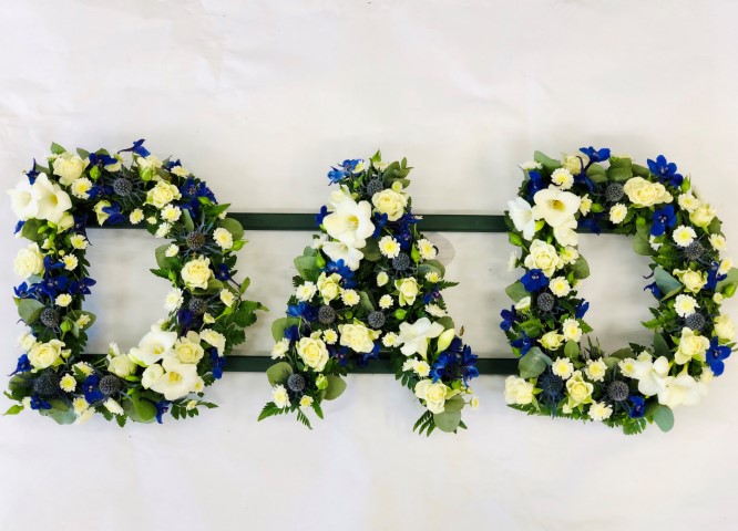 <h2>DAD Funeral Letters | Funeral Flowers</h2>
<ul>
<li>Approximate Size W 90cm H 30cm</li>
<li>Hand created DAD tribute letter in blue and white</li>
<li>To give you the best we may occasionally need to make substitutes</li>
<li>Funeral Flowers will be delivered at least 2 hours before the funeral</li>
<li>For delivery area coverage see below</li>
</ul>
<h2><br />Liverpool Flower Delivery</h2>
<p>We have a wide selection of Funeral Tributes offered for Liverpool Flower Delivery. Funeral Tributes can be provided for you in Liverpool, Merseyside and we can organize Funeral flower deliveries for you nationwide. Funeral Flowers can be delivered to the Funeral directors or a house address. They can not be delivered to the crematorium or the church.</p>
<br>
<h2>Flower Delivery Coverage</h2>
<p>Our shop delivers funeral flowers to the following Liverpool postcodes L1 L2 L3 L4 L5 L6 L7 L8 L11 L12 L13 L14 L15 L16 L17 L18 L19 L24 L25 L26 L27 L36 L70 If your order is for an area outside of these we can organise delivery for you through our network of florists. We will ask them to make as close as possible to the image but because of the difference in stock and sundry items, it may not be exact.</p>
<br>
<h2>Liverpool Funeral Flowers | Letters</h2>
<p>A classic DAD Funeral Tribute covered with spray roses, freesia, eryngium, delphinium, spray chrysanthemums and edged with seasonal foliage.</p>
<br>
<p>Name Funeral Tributes or Letter Funeral Flowers are a way to create a tribute that is truly unique and specially designed for a loved one.</p>
<br>
<p>These are usually selected by family members to indicated their relation to their loved one. Sometimes groups of friends or groups of workplace colleagues select a word they associate with the deceased.</p>
<br>
<p>Letter or Name Funeral Tributes can be done in a massed style of white flowers with small sprays or as mixed flowers where the letters are all written in a variety of flowers of the same colour palette.</p>
<br>
<p>The flowers are arranged in floral foam, which means the flowers have a water source so they look the very best on the day.</p>
<br>
<p>Contents of tribute: white spray roses, white freesia, blue eryngium, blue delphinium, white spray chrysanthemums together with mixed seasonal foliage.</p>
<br>
<h2>Best Florist in Liverpool</h2>
<p>Trust Award-winning Liverpool Florist, Booker Flowers and Gifts, to deliver funeral flowers fitting for the occasion delivered in Liverpool, Merseyside and beyond. Our funeral flowers are handcrafted by our team of professional fully qualified who not only lovingly hand make our designs but hand-deliver them, ensuring all our customers are delighted with their flowers. Booker Flowers and Gifts your local Liverpool Flower shop.</p>
<p><br /><br /><br /></p>
<p><em>Debra G - Review from Yell - Funeral Flowers Liverpool</em></p>
<br>
<p><em>This 5 Star review was from Yell.com - Booker Flowers and Gifts - Reviews</em></p>
<br>
<p><em>Fleur and her team made the flowers for my Dad's funeral. I knew I wanted something quite specific but was quite unsure how to execute the idea. Fleur understood immediately what I was hoping to achieve and developed the ideas into amazingly beautiful flowers that were just perfect. I honestly can't recommend her highly enough - she created something outstanding and unique for my Dad. Thanks Fleur </em></p>
<br>